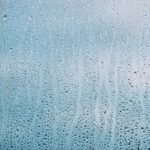 Drops Of Water Or Rain On Wet Glass Background. Moody Photo In C