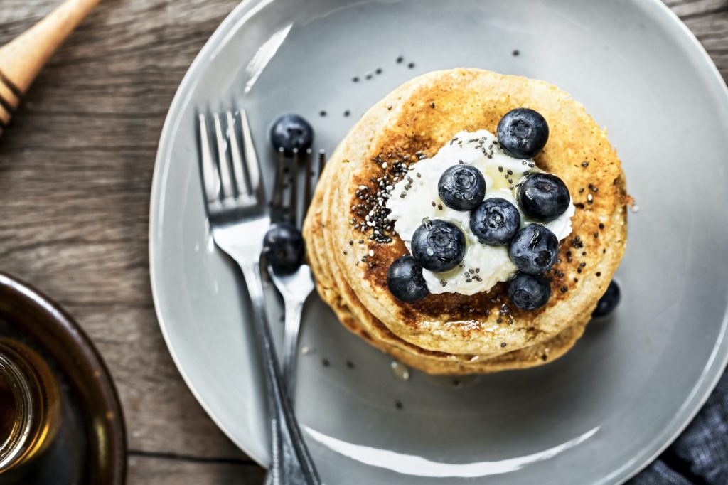 Banana Oat Pancake with fresh Blueberry and Coconut whipped cream
