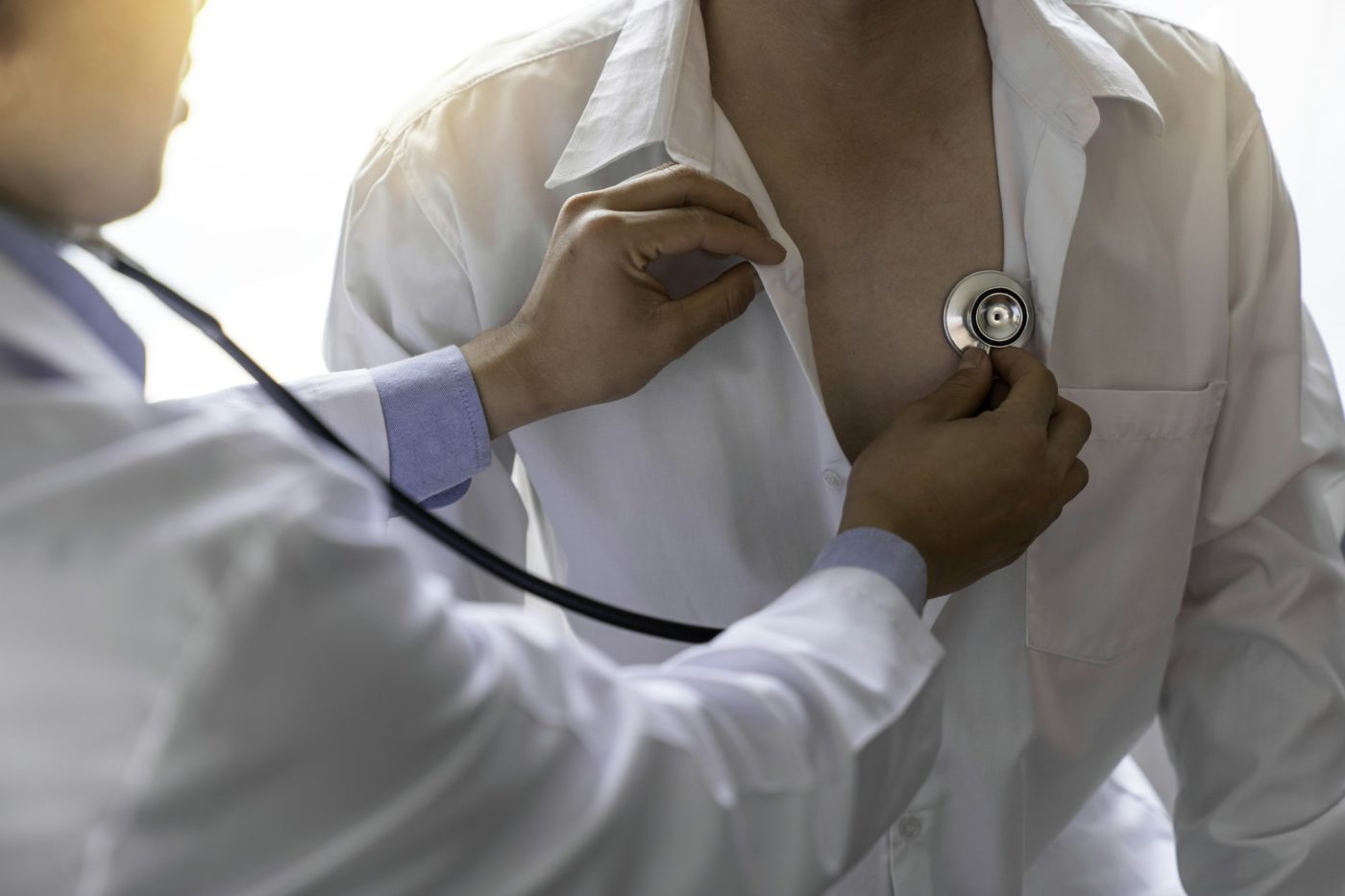 The doctor uses a heart stethoscope. To examine patients with cardiovascular disease, present sympto